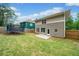 Back yard featuring a grassy area, new wooden fence, and the rear of the house at 1765 Stoney Creek Se Dr, Atlanta, GA 30316