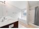 Bathroom featuring double sinks, a soaking tub, and a separate shower with neutral tones at 1765 Stoney Creek Se Dr, Atlanta, GA 30316