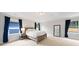 Bright bedroom featuring large windows, a bed, and neutral carpet creates a comfortable retreat at 1765 Stoney Creek Se Dr, Atlanta, GA 30316