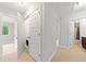 Hallway featuring a laundry closet and access to the Primary bathroom at 1765 Stoney Creek Se Dr, Atlanta, GA 30316