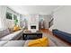 Bright living room with a gray couch, fireplace, and light wood floors offers an inviting space at 1765 Stoney Creek Se Dr, Atlanta, GA 30316