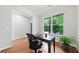 Home office with hardwood floors, a large window for natural light, and a simple, functional setup at 1765 Stoney Creek Se Dr, Atlanta, GA 30316
