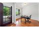 Home office with hardwood floors, a large window for natural light, and a simple, functional setup at 1765 Stoney Creek Se Dr, Atlanta, GA 30316