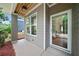 Inviting covered porch with modern siding and a stylish glass front door entrance providing curb appeal at 1765 Stoney Creek Se Dr, Atlanta, GA 30316