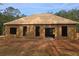 Back exterior view of home under construction, showing unfinished siding and set on a large lot at 190 Harville Rd, Covington, GA 30016