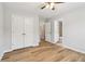 Light-filled bedroom with wood-look floors, neutral walls, and ample closet space at 2620 Bent Creek Dr, Cumming, GA 30041