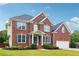 Charming two-story brick home with well-kept lawn and a two-car garage at 2620 Bent Creek Dr, Cumming, GA 30041