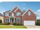 Beautiful two-story brick home with manicured lawn and attached two car garage at 2620 Bent Creek Dr, Cumming, GA 30041