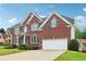 Beautiful brick home with a manicured lawn and two-car garage at 2620 Bent Creek Dr, Cumming, GA 30041