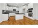 Modern kitchen with white cabinetry, stainless steel appliances, and center island at 2620 Bent Creek Dr, Cumming, GA 30041