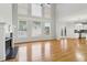 Spacious living room featuring hardwood floors, fireplace, and high ceilings at 2620 Bent Creek Dr, Cumming, GA 30041