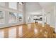 Open-concept living area with hardwood floors and soaring windows providing ample natural light at 2620 Bent Creek Dr, Cumming, GA 30041