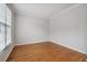 This bedroom features neutral walls, crown molding, and warm hardwood floors at 2620 Bent Creek Dr, Cumming, GA 30041