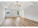 Spacious primary bedroom with tray ceiling, ceiling fan and attractive flooring at 2620 Bent Creek Dr, Cumming, GA 30041