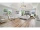 Staged bedroom with lots of windows, seating and a large bed at 2620 Bent Creek Dr, Cumming, GA 30041