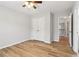 An empty bedroom with wood-look flooring, light gray walls, and a ceiling fan at 2620 Bent Creek Dr, Cumming, GA 30041