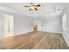 Bright primary bedroom featuring hardwood floors, crown molding and ample space at 2620 Bent Creek Dr, Cumming, GA 30041
