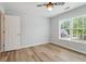 Bedroom featuring wood-look floors, neutral paint, and natural light at 2620 Bent Creek Dr, Cumming, GA 30041