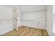 Walk-in closet featuring wire shelving, natural light, and a door at 2620 Bent Creek Dr, Cumming, GA 30041