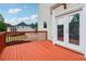 Elevated deck with red railing, overlooking backyard with views of neighborhood at 2620 Bent Creek Dr, Cumming, GA 30041