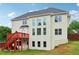 Rear exterior of home with deck and backyard, offering outdoor space and natural light at 2620 Bent Creek Dr, Cumming, GA 30041