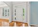 A beautifully trimmed front door with sidelights and transom windows brightens the foyer at 2620 Bent Creek Dr, Cumming, GA 30041