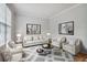 Open concept living room with stylish furniture and decor at 2620 Bent Creek Dr, Cumming, GA 30041