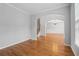 An open-concept living room featuring hardwood floors and an arched entrance to the formal dining at 2620 Bent Creek Dr, Cumming, GA 30041