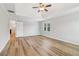 Main bedroom with a tray ceiling, ceiling fan and two windows at 2620 Bent Creek Dr, Cumming, GA 30041