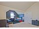 Shared bedroom with two beds, gray walls, a comfy chair, and plenty of space at 3877 Valley Bluff Ln, Snellville, GA 30039