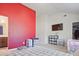 Spacious bedroom with red accent wall and plenty of storage space at 3877 Valley Bluff Ln, Snellville, GA 30039