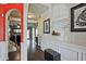 Elegant hallway with detailed moldings, archways, and hardwood floors leading to a brightly lit living space at 3877 Valley Bluff Ln, Snellville, GA 30039