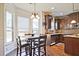 Gourmet kitchen featuring granite countertops, stainless steel appliances, and custom cabinetry at 3877 Valley Bluff Ln, Snellville, GA 30039