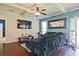A relaxing living room shows hardwood floors, coffered ceilings, and backyard access at 3877 Valley Bluff Ln, Snellville, GA 30039