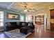 A comfortable living room shows coffered ceilings, backyard access, and open view to kitchen at 3877 Valley Bluff Ln, Snellville, GA 30039
