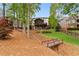 This home has a stunning backyard with multi-level deck, stone patio, lush landscaping, and small bridge at 5106 Davis Love Dr, Cumming, GA 30041