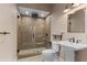 This bathroom offers a modern shower stall, toilet, and vanity sink at 5106 Davis Love Dr, Cumming, GA 30041