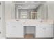 Bathroom with a double sink vanity and a large mirror at 5106 Davis Love Dr, Cumming, GA 30041