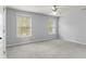 Bedroom with a ceiling fan and windows at 5106 Davis Love Dr, Cumming, GA 30041
