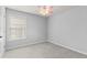 A bedroom with a window and ceiling fan at 5106 Davis Love Dr, Cumming, GA 30041