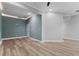 This bedroom features a neutral color palette, modern ceiling, and wood flooring at 5106 Davis Love Dr, Cumming, GA 30041