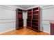 Walk-in closet with custom shelving and hardwood floors at 5106 Davis Love Dr, Cumming, GA 30041
