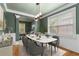 This dining room offers a modern aesthetic with a marble table, stylish decor, and natural lighting at 5106 Davis Love Dr, Cumming, GA 30041