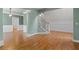 Bright, spacious living room featuring hardwood floors and trimmed entryway columns for a luxurious feel at 5106 Davis Love Dr, Cumming, GA 30041