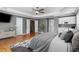 A spacious main bedroom features wood floors, a gray color scheme, and a partial kitchenette space at 5106 Davis Love Dr, Cumming, GA 30041