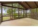 Relax on this screened porch with vaulted ceiling and panoramic views at 5106 Davis Love Dr, Cumming, GA 30041