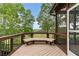 Relax on this screened porch with serene views of the surrounding landscape at 5106 Davis Love Dr, Cumming, GA 30041