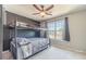 Bedroom with a bunk bed, plush carpet, and a window view of the outdoors at 1542 Armende Cir, Dacula, GA 30019