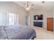 Spacious bedroom features vaulted ceilings, carpet, and a wall-mounted TV at 1542 Armende Cir, Dacula, GA 30019