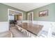 Charming dining room with a wooden table, stylish seating, and natural light at 1542 Armende Cir, Dacula, GA 30019